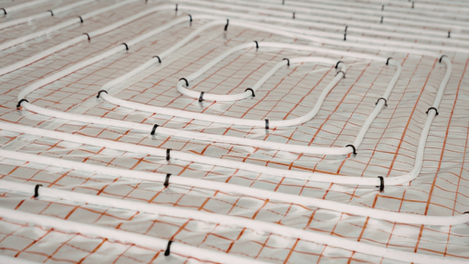 Water underfloor heating pipework installed as part of a low temperature heating system